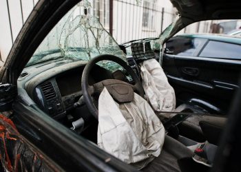 Car after accident. Car interior with airbag after crash