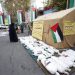 People stand near mock objects symbolising dead children during a campaign to collect donations for Palestinians in Gaza at Palestine Square in Tehran, Iran. [Abedin Taherkenareh/EPA]