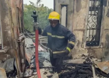 FCT Fire Service officer during the fire incident at the residence of the Minister of State, Dr Mariya Mahmoud, in Asokoro, Abuja on Sunday