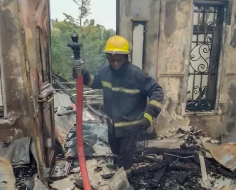 FCT Fire Service officer during the fire incident at the residence of the Minister of State, Dr Mariya Mahmoud, in Asokoro, Abuja on Sunday