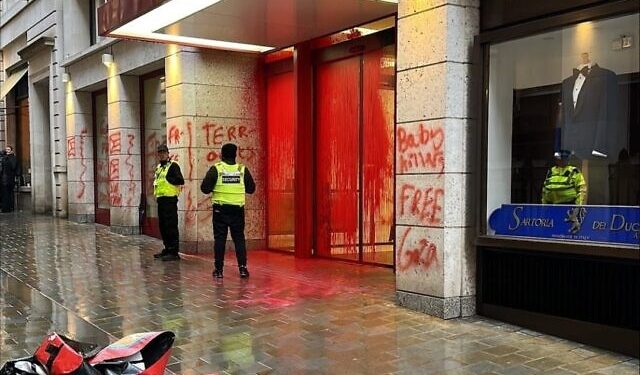 Police apprehends five after protesters spray red paint over Ministry of Defence in UK