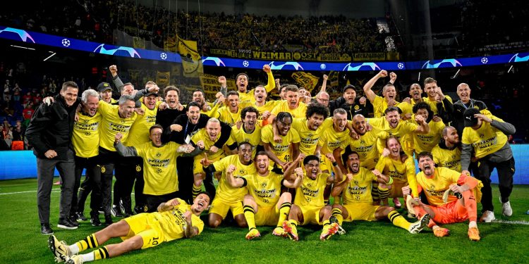 Borussia Dortmund celebrating their victory over PSG in the UEFA Champions League