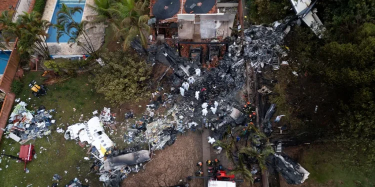 Brazil investigates plane crash as rescue teams evacuate 50 bodies from scene of incident