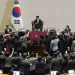 Lawmakers of the ruling People Power Party protest to South Korea's National Assembly Speaker Woo Won-shik, top center, during a plenary session for the impeachment motion against South Korean acting President Han Duck-soo at the National Assembly in Seoul, South Korea, Friday, Dec. 27, 2024.