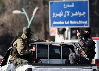 Fighters of the ruling Syrian body patrol, in Damascus