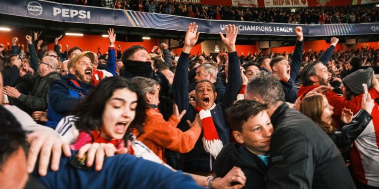 Arsenal fans celebrating their win over Real Madrid during the Champions League match at the Emirates Stadium. [PHOTO CREDIT: Official X account of Arsenal FC | @Arsenal]