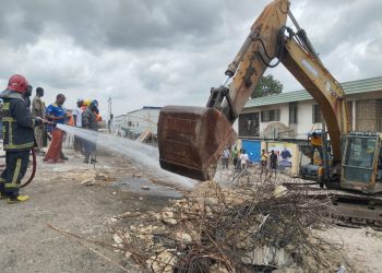 Emergency responders at the site of a collapsed building at Ojodu, Lagos