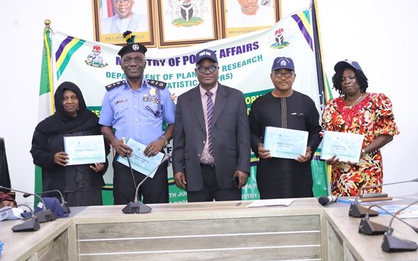 Mr. Francis Pius (Procurement), Deputy Director, Information & Public Relations Unit, Bolaji Oladimeji Kazeem, Commandant Police College (Wudil, Kano), AIG Patrick Adedeji Atayero, Permanent Secretary, Dr Anuma Ogbonnaya Nlia, Deputy Director, Reform Coordinator and Service Improvement, Hamisu Hassan Ibrahim, Mrs. Onifade Comfort (Internal Audit) during the signing ceremony held at the Sector-Wide Ministerial Performance Management System (MPMS) retreat in the Headquarters of the Ministry of Police Affairs, Federal Secretariat, Phase III, Abuja.