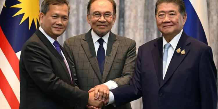 Malaysia's Prime Minister Anwar Ibrahim (C), Cambodia's Prime Minister Hun Manet (L) and Thailand's acting Prime Minister Phumtham Wechayachai (R)