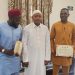 Kogi State Governor, Ahmed Usman Ododo receiving the first batch of returning participants