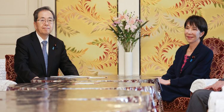 Japan Liberal Democratic Party (LDP) President Sanae Takaichi (R) and Komeito Party leader Tetsuo Saito