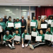 D'Tigress display their documents for houses and national honours promised by President Bola Tinubu after their 2025 Afrobasket victory in Côte d’Ivoire