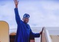 President Bola Tinubu waves as he departs Nigeria for an official engagement
