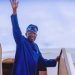 President Bola Tinubu waves as he departs Nigeria for an official engagement