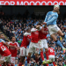 Manchester City's Norwegian striker #09 Erling Haaland (R) heads the ball in front of goal during the English Premier League football match between Manchester City and Arsenal at the Etihad Stadium in Manchester, north west England