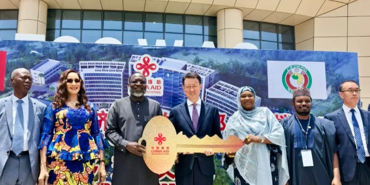 3rd from right, ECOWAS Commission President Dr Omar Touray, receiving the symbolic key to the new ECOWAS Headquarters from Chinese Ambassador to Nigeria and ECOWAS, Yu Dunhai, 4th from right, at the handover ceremony on Tuesday in Abuja