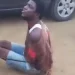 The restrained suspect begging the police officer