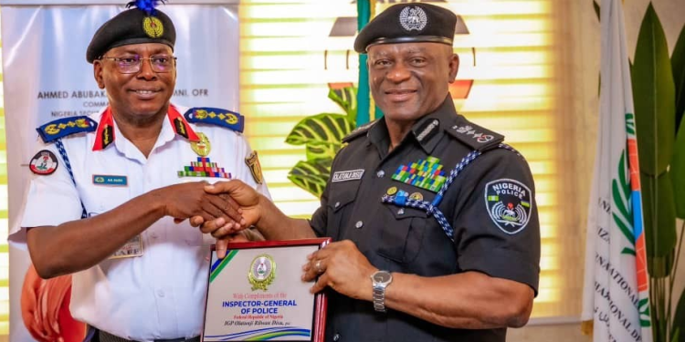 The Commandant General of the NSCDC, Ahmed Audi and Inspector General of Police, Tunji Disu during the IG's visit