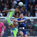 Manchester City's Spanish midfielder #16 Rodri (L) jumps with Chelsea's English striker #09 Liam Delap during the English Premier League football match between Chelsea and Manchester City at Stamford Bridge in London on April 12, 2026.