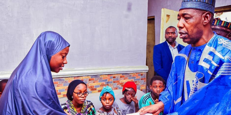 Borno governor, Babagana Zulum, during the visit to the families of the deceased officers.