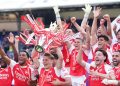 Arsenal players celebrating after lifting EPL trophy after 22 years