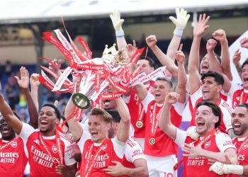 Arsenal players celebrating after lifting EPL trophy after 22 years