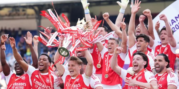 Arsenal players celebrating after lifting EPL trophy after 22 years