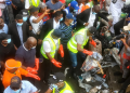 Sanwo-Olu clearing refuse during the monthly environmental sanitation exercise on Saturday