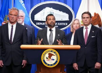 FBI Director Kash Patel, flanked by Acting Attorney General Todd Blanche and Secretary of Health and Human Services Robert F. Kennedy Jr., speaks during a press conference at the Department of Justice in Washington, DC on Tuesday.