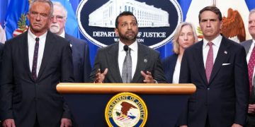 FBI Director Kash Patel, flanked by Acting Attorney General Todd Blanche and Secretary of Health and Human Services Robert F. Kennedy Jr., speaks during a press conference at the Department of Justice in Washington, DC on Tuesday.