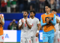 Iran's defender #05 Milad Mohammadi and teammates greet supporters after the 2026 World Cup Group G football match between Iran and New Zealand at Los Angeles Stadium in Inglewood