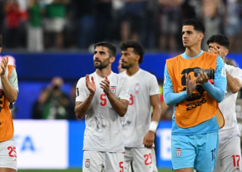 Iran's defender #05 Milad Mohammadi and teammates greet supporters after the 2026 World Cup Group G football match between Iran and New Zealand at Los Angeles Stadium in Inglewood