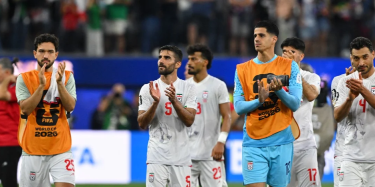 Iran's defender #05 Milad Mohammadi and teammates greet supporters after the 2026 World Cup Group G football match between Iran and New Zealand at Los Angeles Stadium in Inglewood