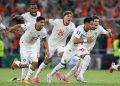 Moroccan players in jubilation after the penalties were decided.
