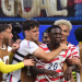 US forward #20 Folarin Balogun, C, celebrates scoring his team's third goal with teammates during the 2026 World Cup Group D football match between USA and Paraguay at the Los Angeles Stadium in Inglewood on June 12, 2026