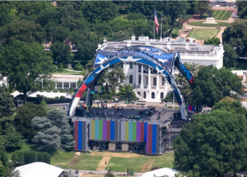 Workers prepare the UFC stage at the White House