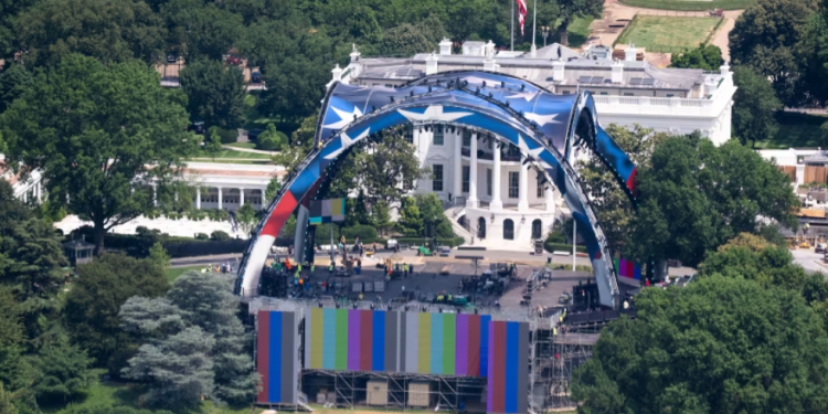 Workers prepare the UFC stage at the White House