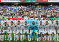 Iran players pose for a team group photograph before their 2026 FIFA World Cup opening game against New Zealand, which ended in a 2-2 draw