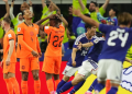 Japan celebrate their late equalizer against Netherlands scored by Daichi Kamada