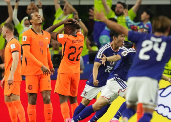 Japan celebrate their late equalizer against Netherlands scored by Daichi Kamada