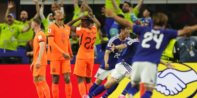 Japan celebrate their late equalizer against Netherlands scored by Daichi Kamada