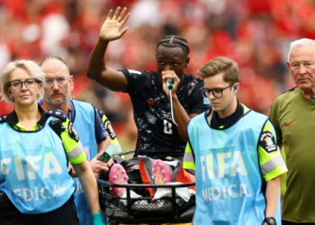 Canada’s Ismael Kone waves to the crowd as he uses a ‘green whistle’, Penthrox, a portable, self-administered inhaler used by paramedics for fast-acting pain relief, after sustaining an injury and being stretchered off