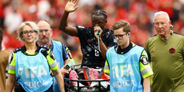 Canada’s Ismael Kone waves to the crowd as he uses a ‘green whistle’, Penthrox, a portable, self-administered inhaler used by paramedics for fast-acting pain relief, after sustaining an injury and being stretchered off