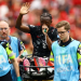 Canada’s Ismael Kone waves to the crowd as he uses a ‘green whistle’, Penthrox, a portable, self-administered inhaler used by paramedics for fast-acting pain relief, after sustaining an injury and being stretchered off
