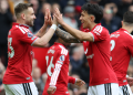 Manchester United's English defender, 23 Luke Shaw, L, celebrates with Manchester United's Argentinian defender, 06 Lisandro Martinez, R, after scoring the opening goal during the English Premier League football match between Manchester United and Nottingham Forest at Old Trafford in Manchester, northwest England, on May 17, 2026