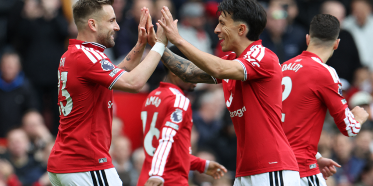 Manchester United's English defender, 23 Luke Shaw, L, celebrates with Manchester United's Argentinian defender, 06 Lisandro Martinez, R, after scoring the opening goal during the English Premier League football match between Manchester United and Nottingham Forest at Old Trafford in Manchester, northwest England, on May 17, 2026