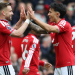 Manchester United's English defender, 23 Luke Shaw, L, celebrates with Manchester United's Argentinian defender, 06 Lisandro Martinez, R, after scoring the opening goal during the English Premier League football match between Manchester United and Nottingham Forest at Old Trafford in Manchester, northwest England, on May 17, 2026