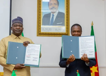 Nigeria's Minister of Defense, General Christopher Musa, retd, and Cameroon's Minister Delegate at the Presidency in Charge of Defense, Mr. Joseph Assomo, after signing the MoU