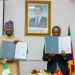 Nigeria's Minister of Defense, General Christopher Musa, retd, and Cameroon's Minister Delegate at the Presidency in Charge of Defense, Mr. Joseph Assomo, after signing the MoU