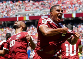 Qatar's Pedro Miguel celebrating after Boualem Khoukhi scored the equalizer against Switzerland four minutes into injury time